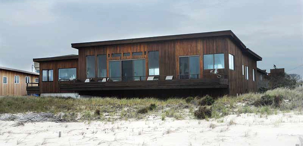 One story, brown, beachfront home